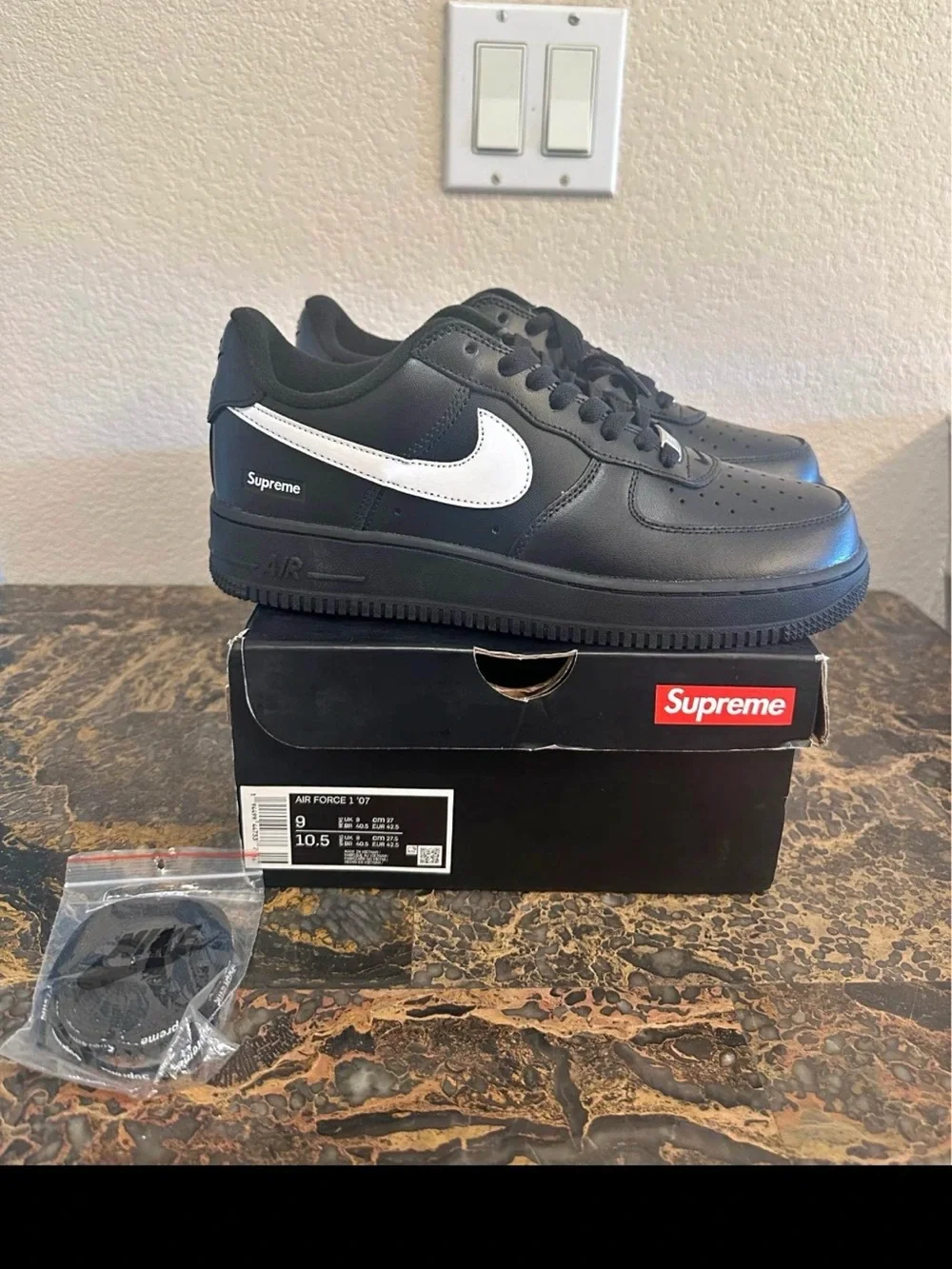 Nike Black Leather Low-Top Sneakers with White Swoosh